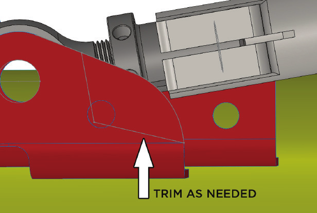 Diagram showing where to trim the factory track bar bracket for pinch block clearance